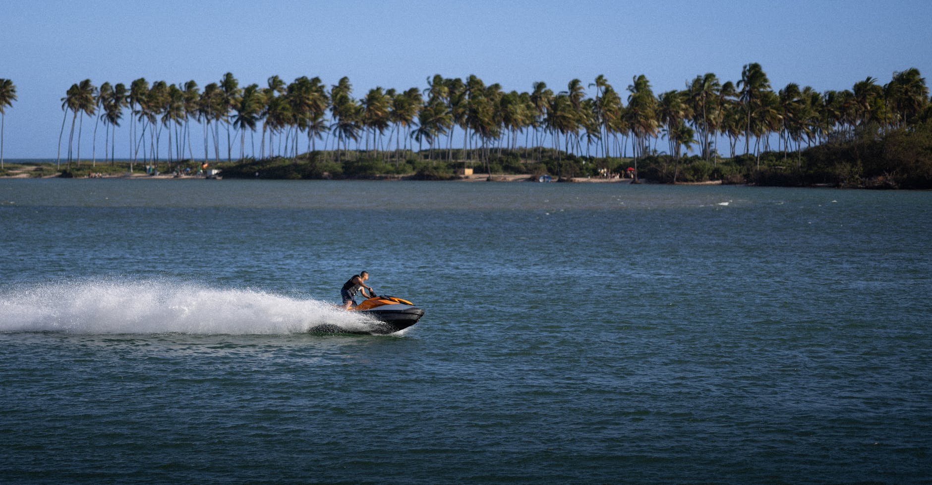 Water sports at a Key West beach — jet skiing and parasailing at Smathers Beach
