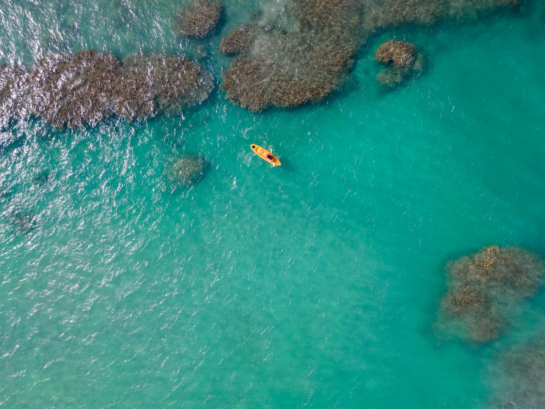 Turquoise ocean water with kayak — planning Key West vacation activities and water sports
