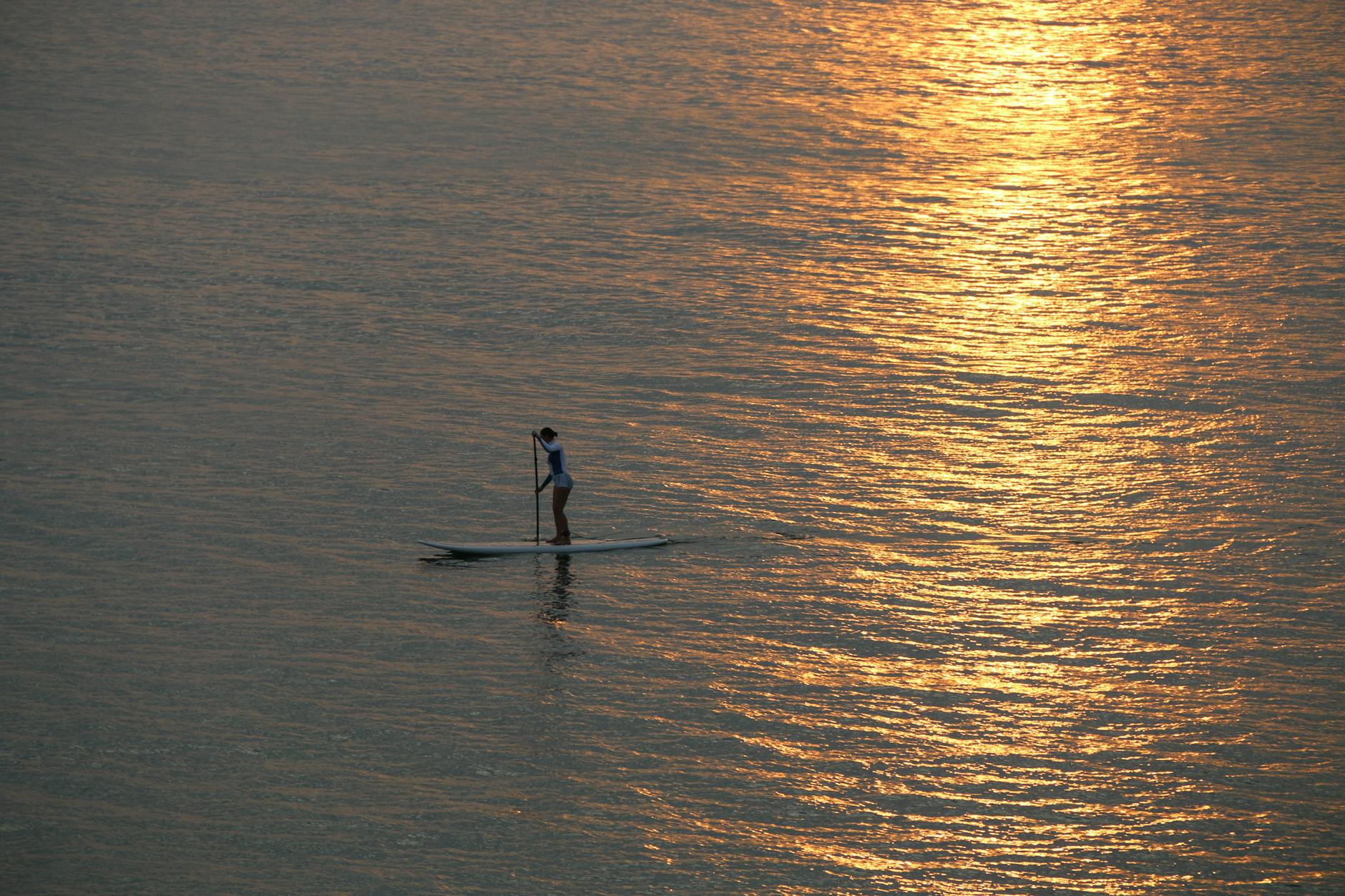 Stand-up paddleboarding on calm turquoise water — Key West water sports SUP