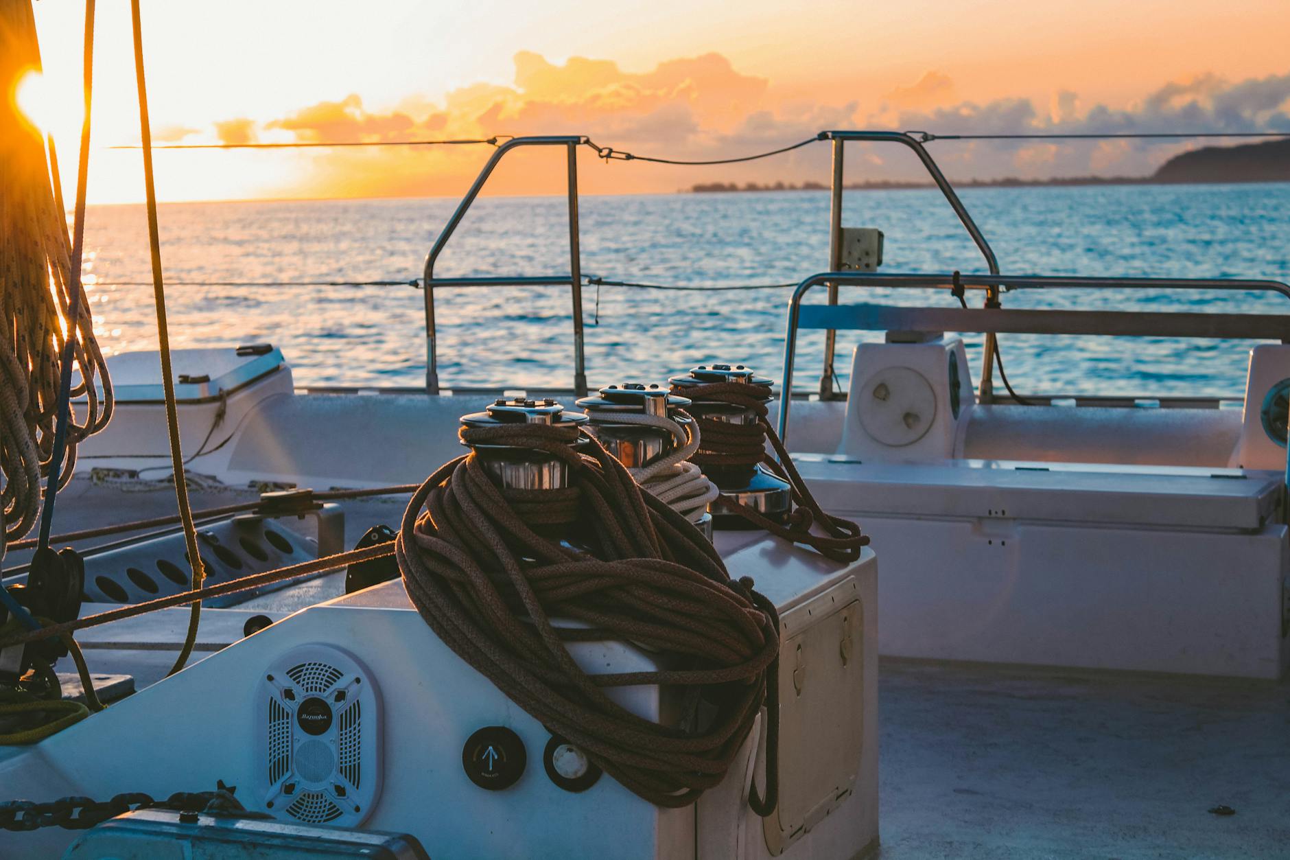 Sunset cruise on tropical waters with golden sky — Key West water sports sunset sailing