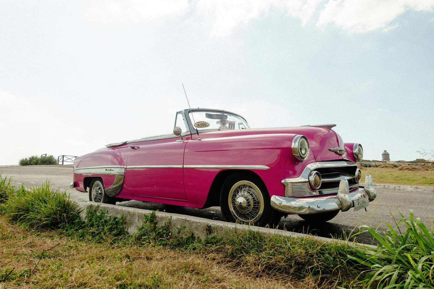 Convertible car on a scenic coastal road for the drive to Key West