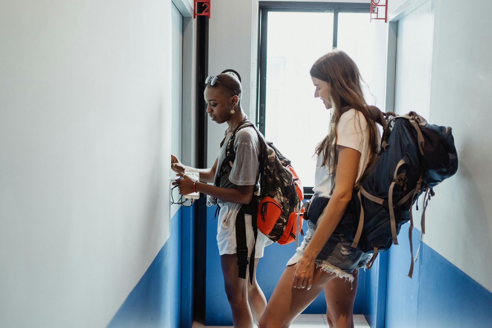Budget travelers with backpacks at a Key West hostel