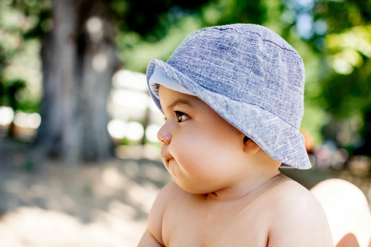 A baby in a sun hat in Key West