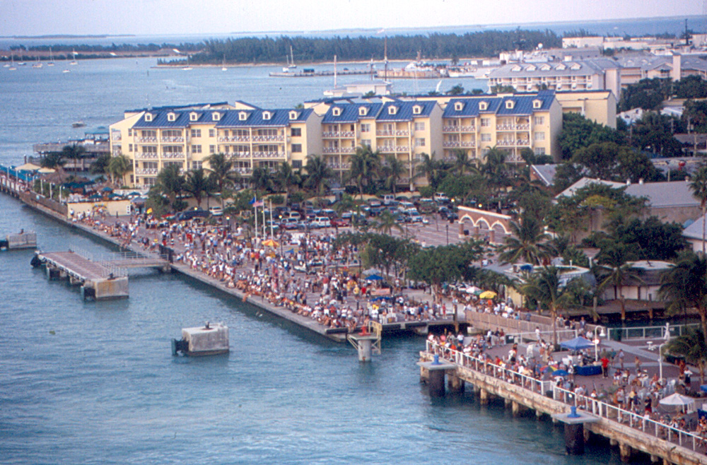 Aerial view of crowds lining the Mallory Square waterfront in Key West for the sunset celebration