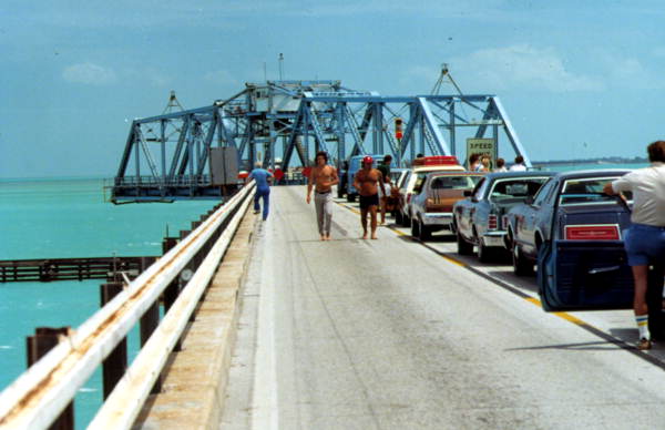 Archival photograph of cars queued on the old narrow Seven Mile Bridge while the Moser Channel swing span stands open
