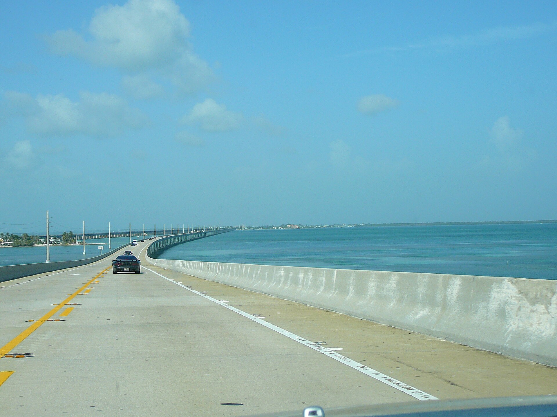 Driving over the high hump of the Seven Mile Bridge at Moser Channel with the old bridge visible alongside